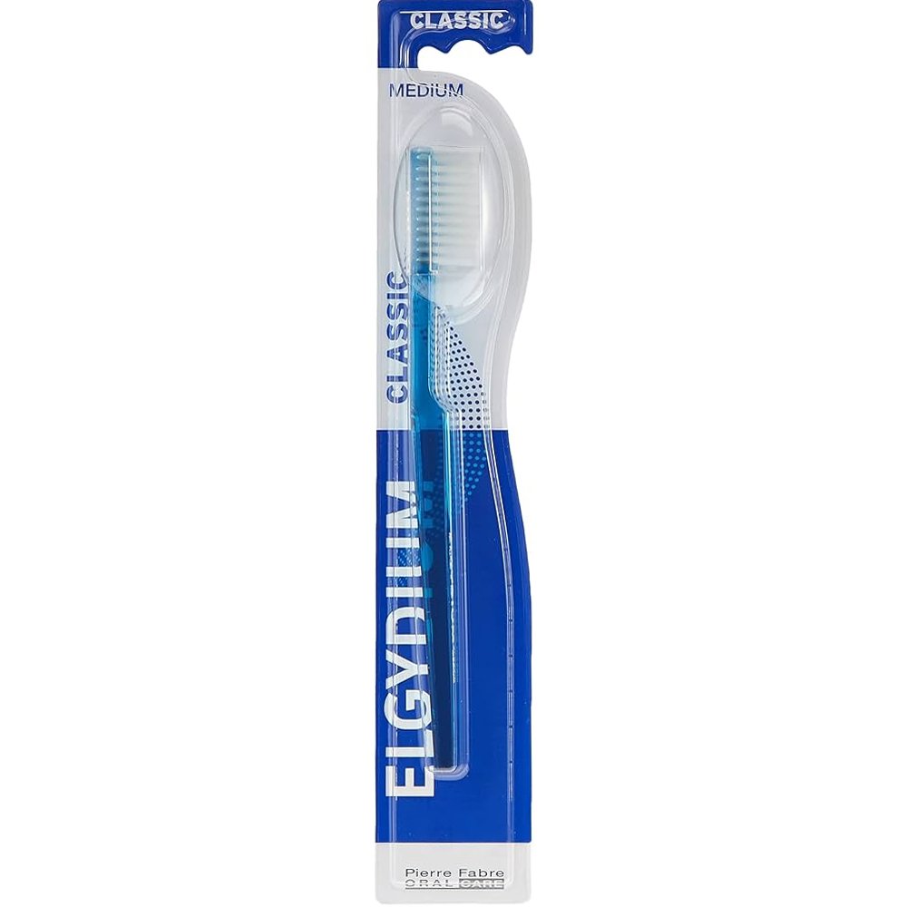 Elgydium Classic Medium Toothbrush Χειροκίνητη Οδοντόβουρτσα Ενηλίκων Μέτριας Σκληρότητας με Εργονομική Λαβή & Αποστρογγυλεμένες Ίνες 1 Τεμάχιο – Γαλάζιο